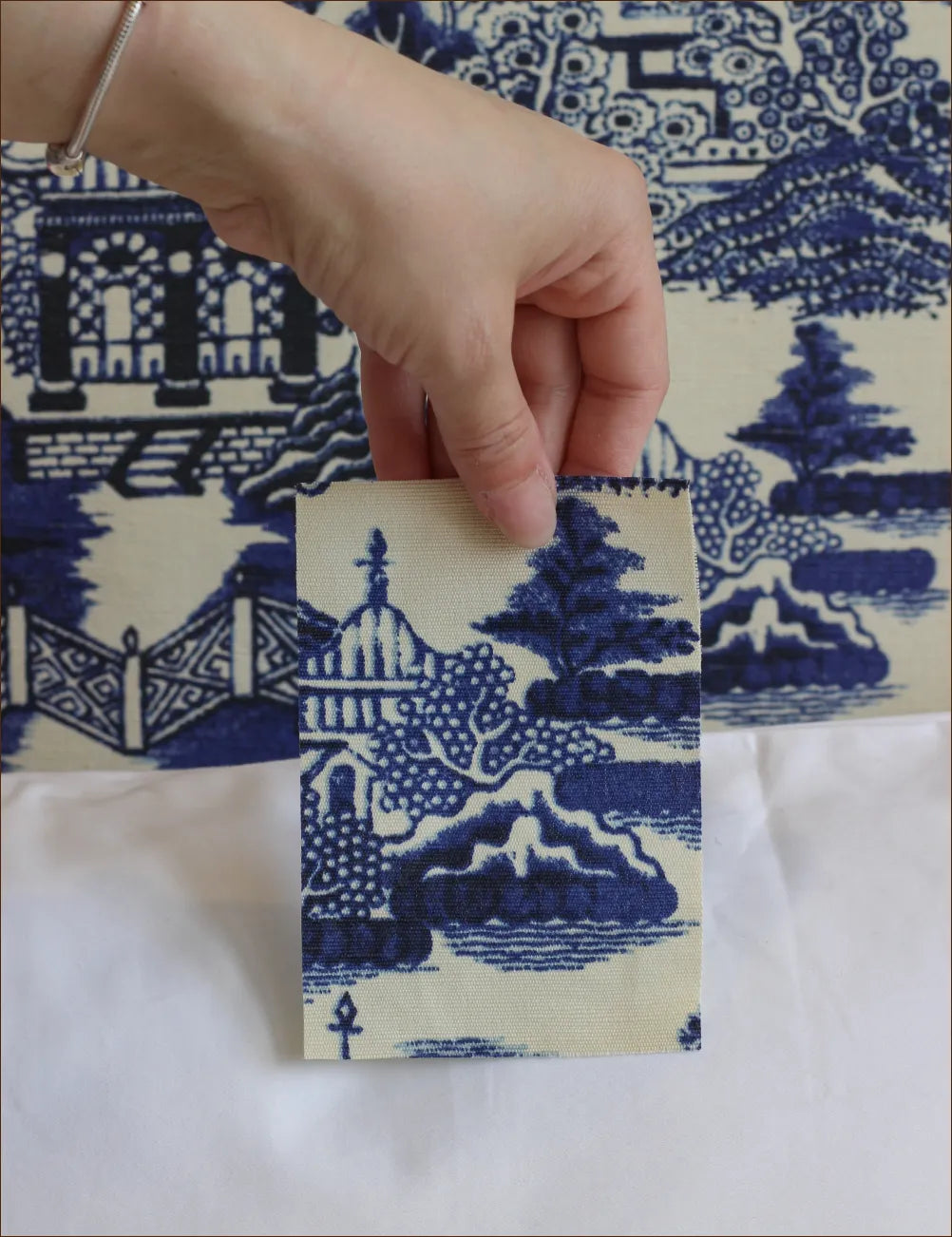 Bolster cushion in Willow Ink (Beata Heuman)